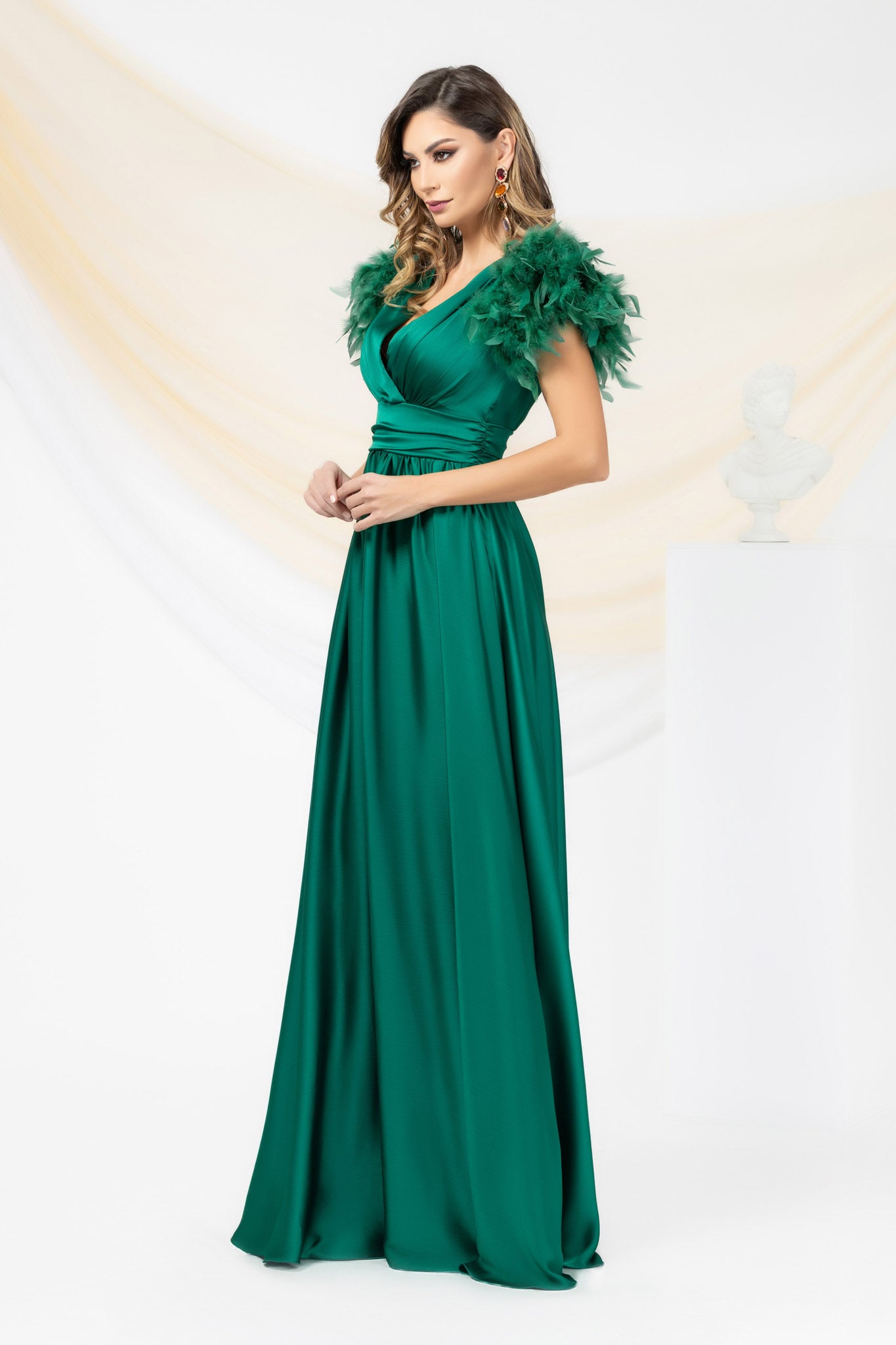 Green Long Occasional Dress With Sleeves Elegantly Accessorized With Feathers