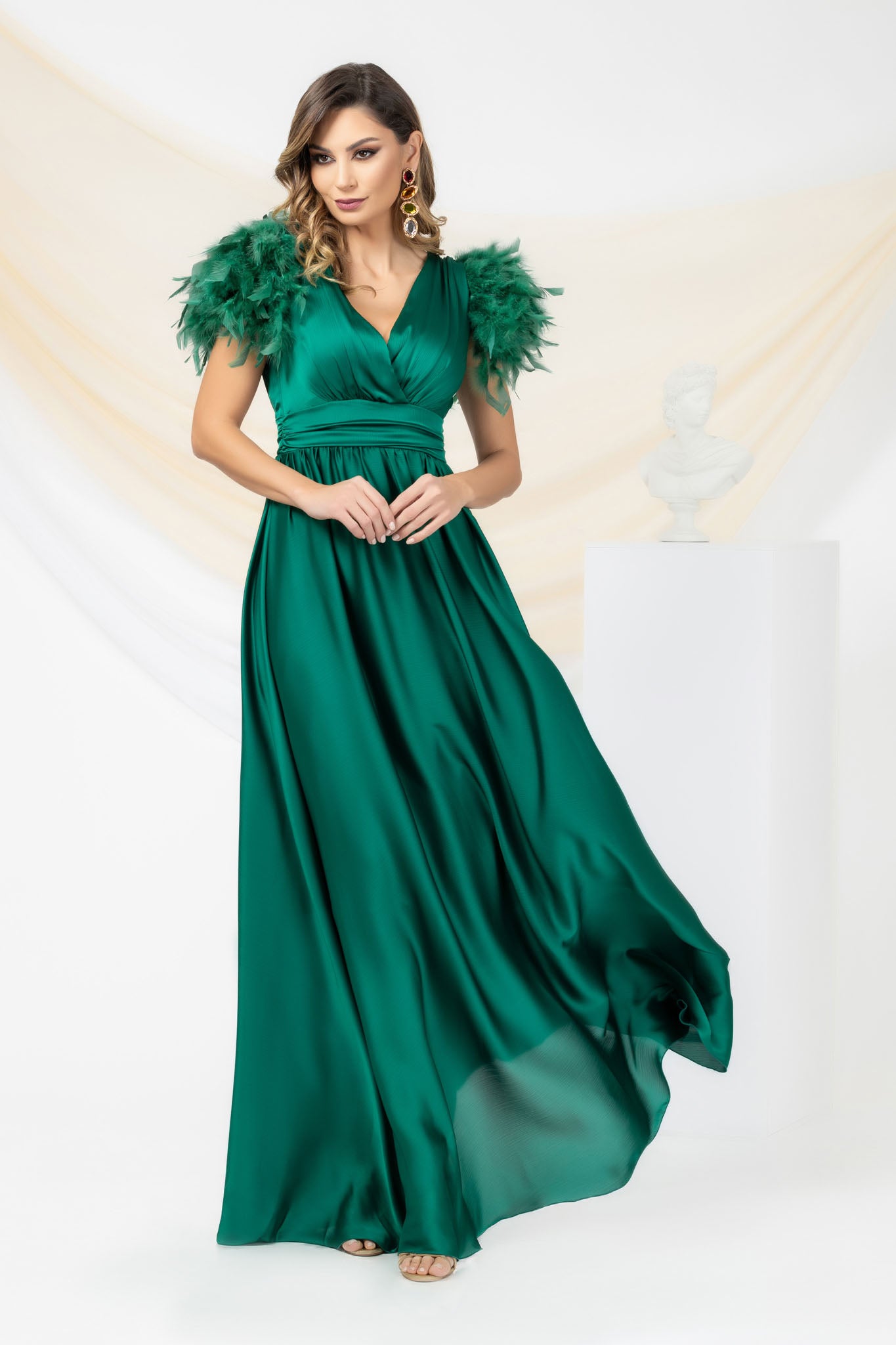 Green Long Occasional Dress With Sleeves Elegantly Accessorized With Feathers