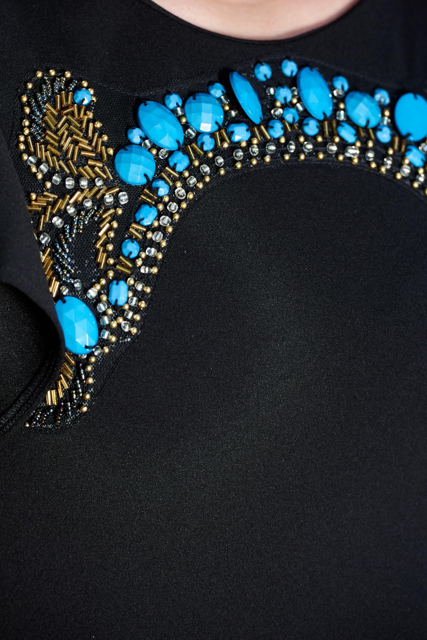 Black dress with small beads embellished details and cut back