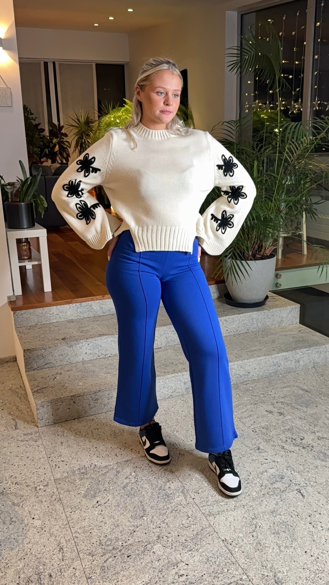 Elegant Ivory Sweater with Black Bow Accents