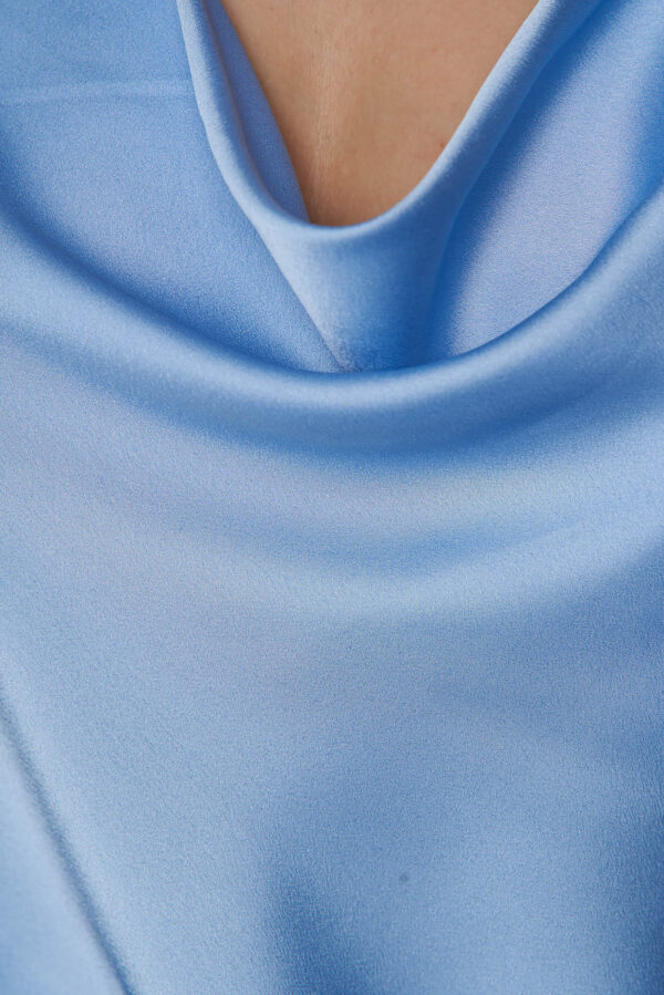 Light Blue Top With Wide Satin Cuts With straps And Dropped Neckline.